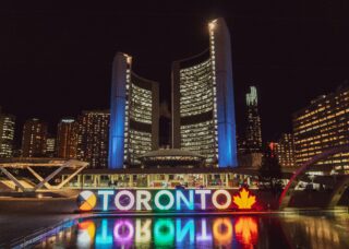 buildings at night in Toronto, Canada; skip tracing services in Canada