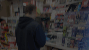 man buying alcohol at counter
