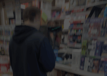 man buying alcohol at counter